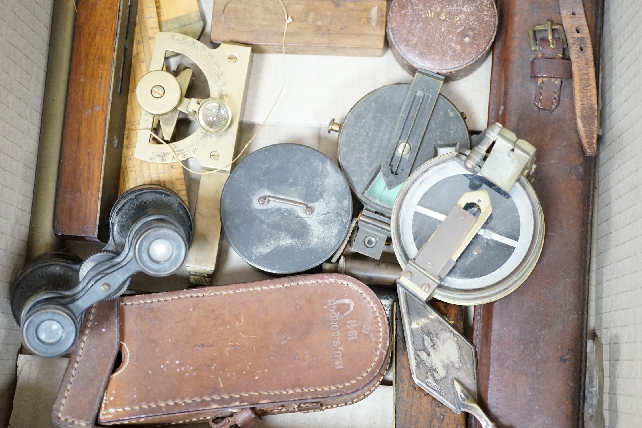 A group of surveying and scientific instruments, early 20th century, including and Elliot brothers London pocket sextant A in the Negretti and Zambra London compass, 80 Cook and Sons York and London level, military issue